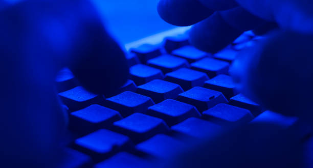 istock Criminal buying in dark net. POV man typing on keyboard 701249434