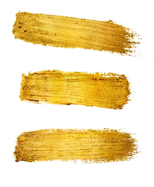 istock Gold paint brush stroke on white background. 701249480