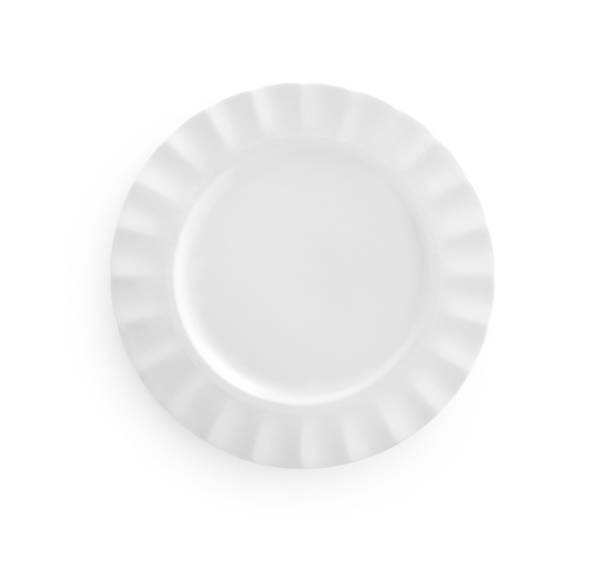 istock Top view of white empty plate isolated on white 701249550