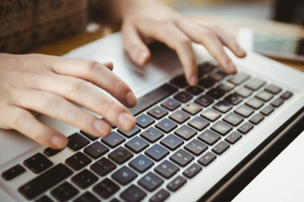 istock Close up of hands typing on a laptop 701257664