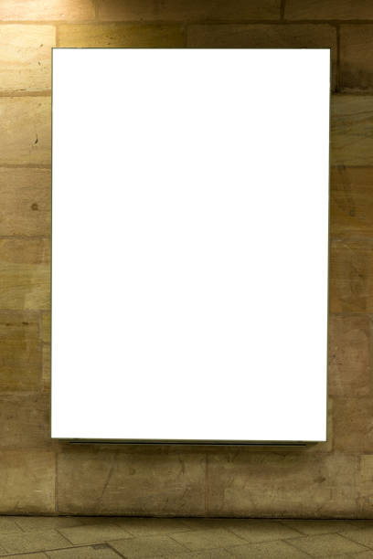 istock Blank ad space sign isolated on a brick wall in the subway 701263072