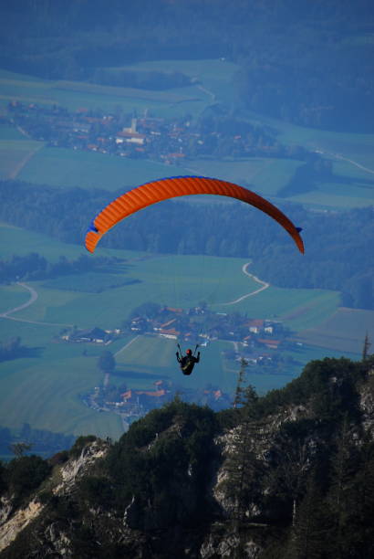 istock High Angle View Of Person Paragliding Over Mountain 702605089