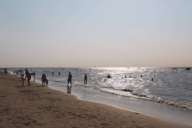 istock Silhouette People Enjoying At Beach Against Sky During Sunset 702609157