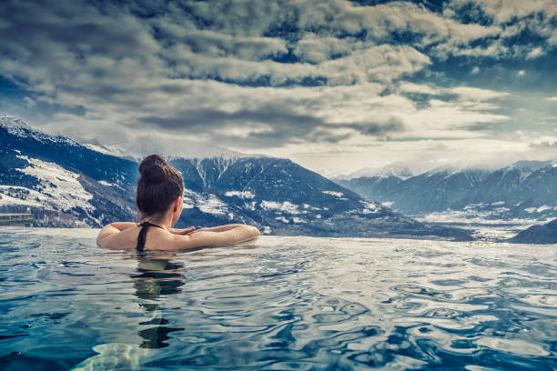 istock Woman Swimming In Pool 702612781