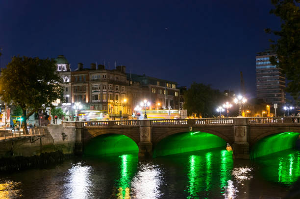 istock Bridge Over River With Buildings In Background 702675717