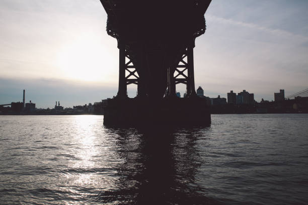 istock Low Angle View Of Manhattan Bridge Over East River Against Sky 705162695
