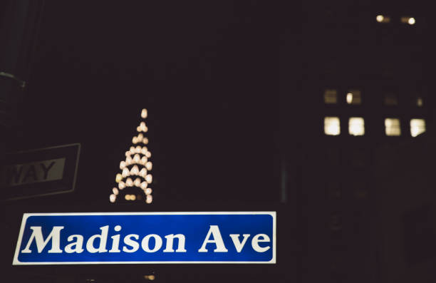 istock Low Angle View Of Text On Sign Board Against Illuminated Chrysler Building At Night 705166165