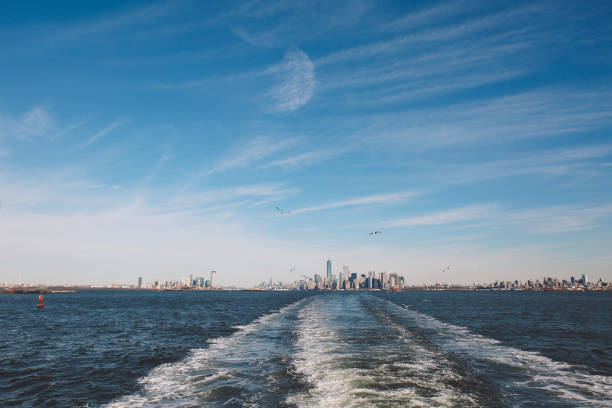 istock Sea By Cityscape Against Sky 705167203