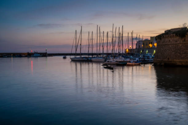istock Sailboats Moored At Harbor During Sunset 705181857