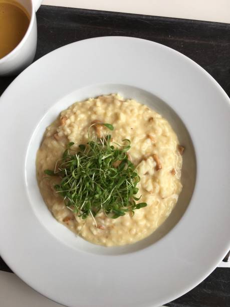 istock Directly Above Shot Of Risotto With Arugula In Plate On Table 705209191