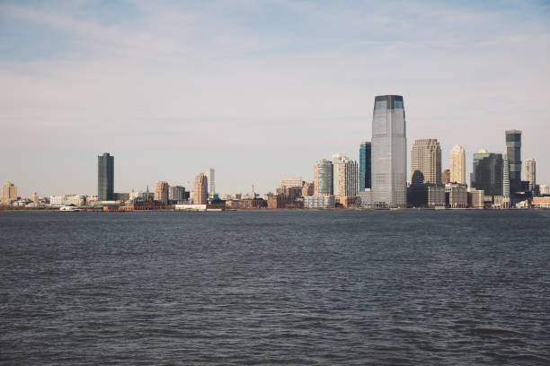 istock Sea By Cityscape Against Sky 705286151
