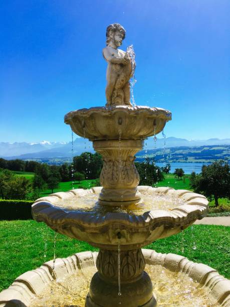 istock Fountain Against Blue Sky On Sunny Day At Park 707499881