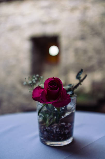 istock Close-Up Of Rose In Glass On Table 707500663