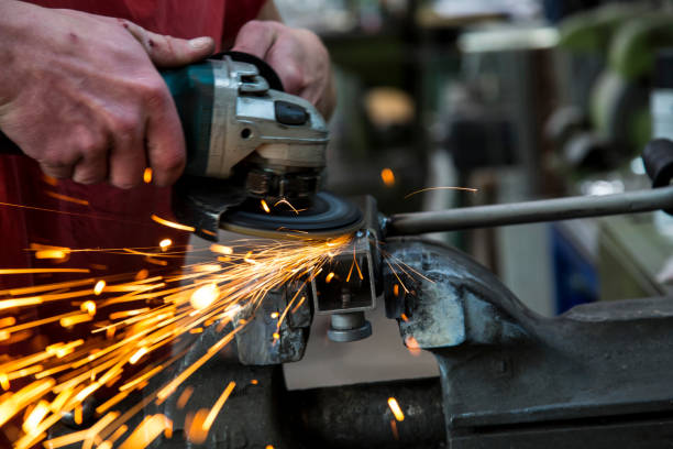 istock Cropped Hand Of Worker Cutting Iron Rod At Industry 707507775