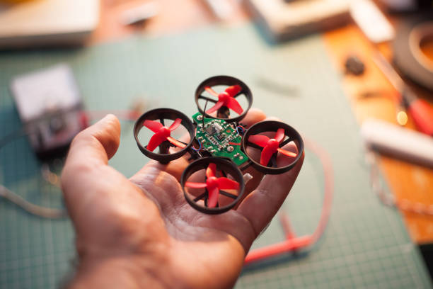 istock Cropped Image Hand Of Incomplete Drone Model 707557025