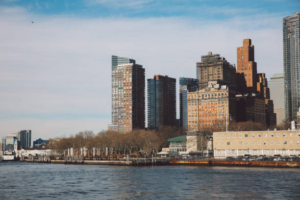 istock Low Angle View Of River By Cityscape Against Sky 707566371