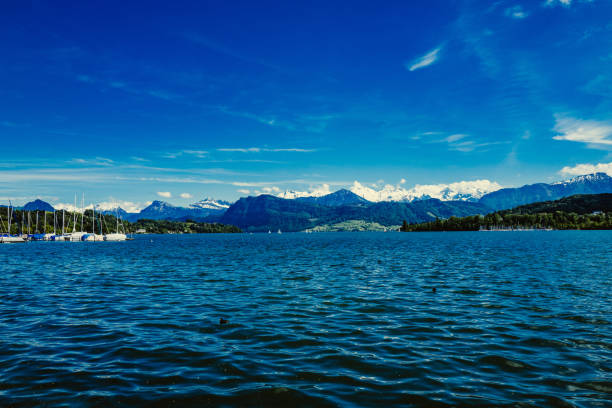 istock Scenic View Of Sea By Mountain Range Against Blue Sky 709219933