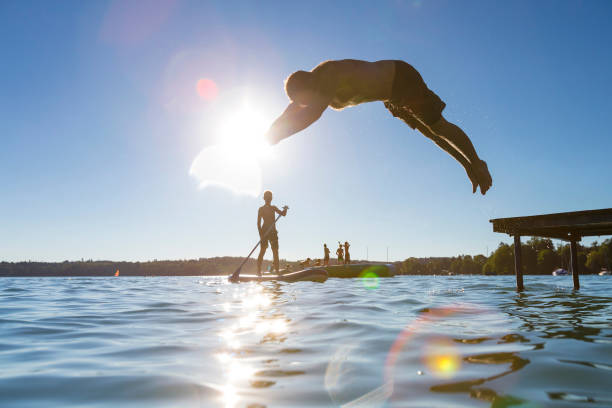 istock Silhouette Of People In Sea 709224247