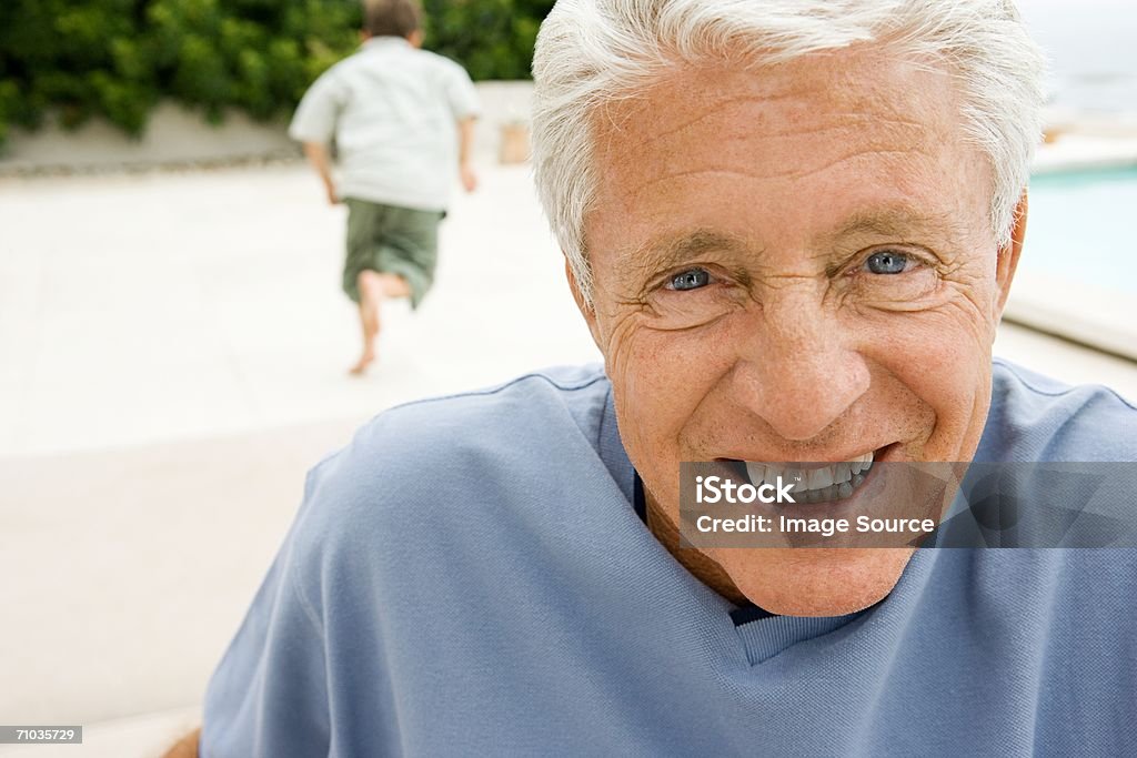 Grandparent with child playing in background - Foto de stock de Avós e Avôs royalty-free