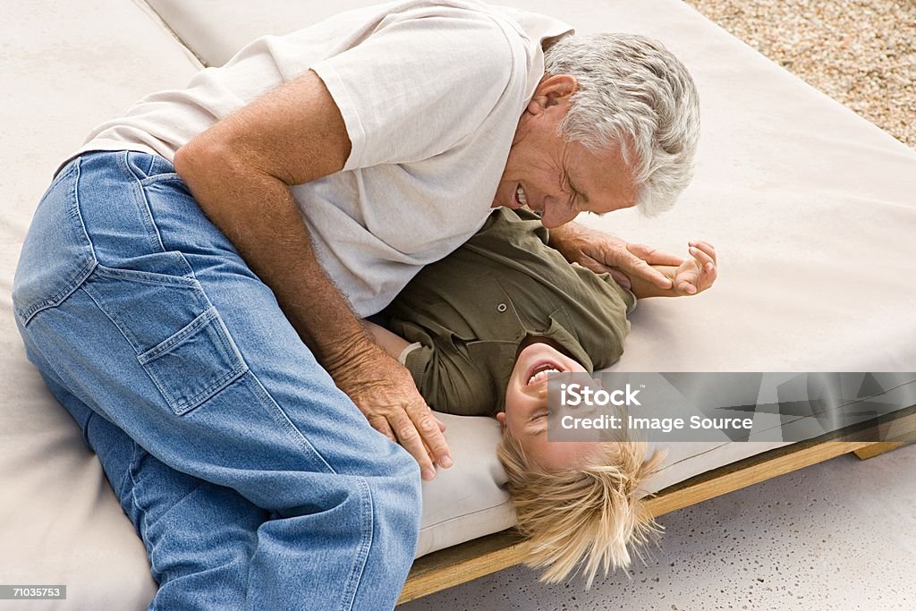 Grandparent and grandchild playing - Foto de stock de Adulto royalty-free