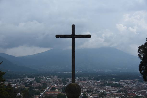 istock Cross On Mountain Against Cloudy Sky 713793131