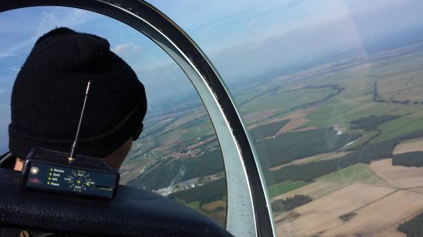 istock Man With Hat Looking Out Of Airplane Window 713793139