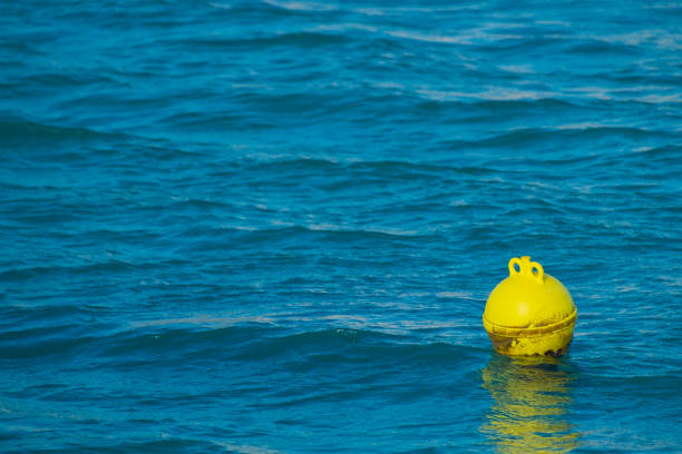 istock Yellow Buoy Floating On Sea 713843517