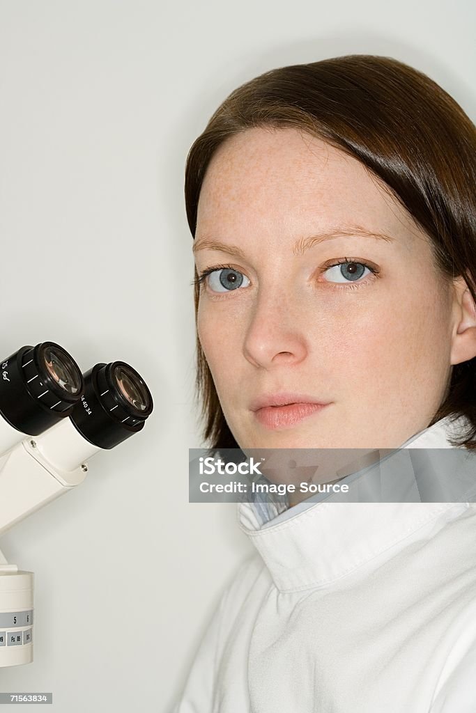 Scientist using microscope  30-39 Years Stock Photo