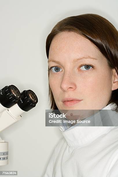 Scientist Using Microscope Stock Photo - Download Image Now - 30-39 Years, Adult, Adults Only