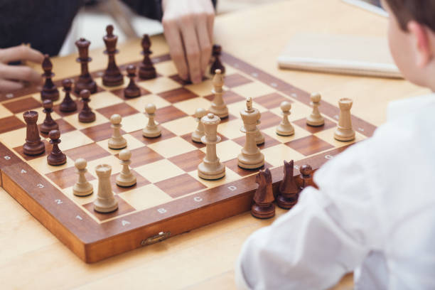 istock Close-Up Of People Playing Chess 717386209