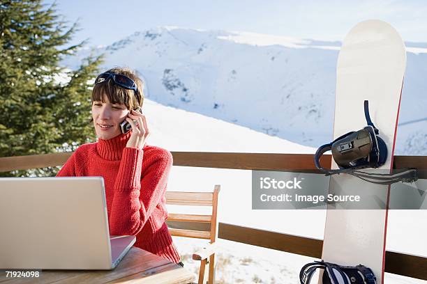 Snowboarder Using Laptop Stock Photo - Download Image Now - Laptop, Mobile Phone, Ski Holiday