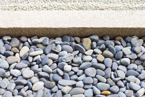 Background with white and gray stones softly rounded and washed from sea water