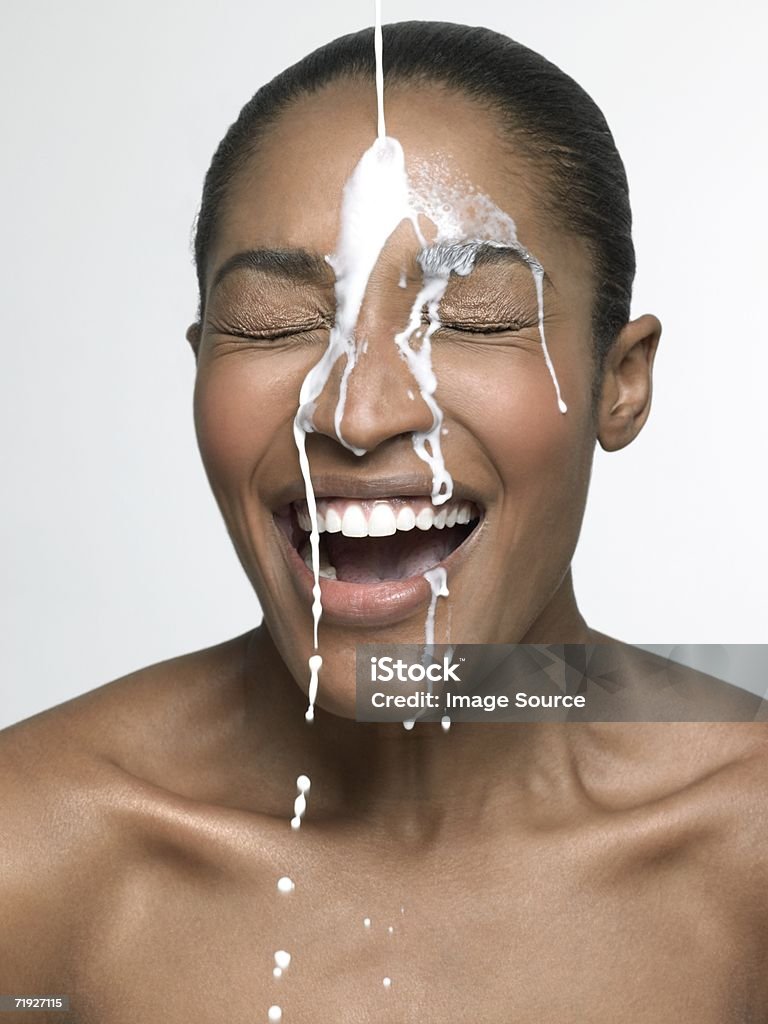 Milk pouring onto woman  Milk Stock Photo