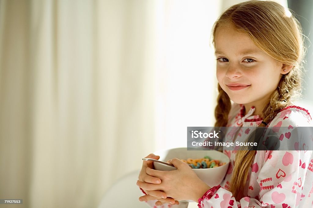 Girl with a bowl of cereal  Bowl Stock Photo