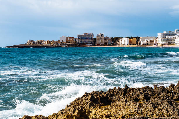 istock Sea By Cityscape Against Sky 720147653