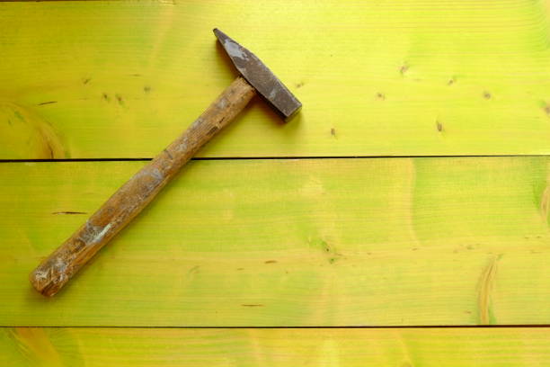 istock High Angle View Of Hammer On Green Wooden Table 722302363