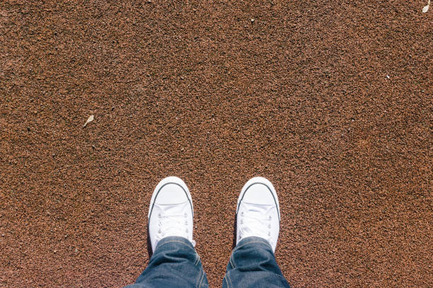 istock Low Section Of Person Standing On Field 722308263