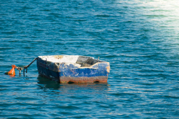 Wooden migrant boat shipwreck washed ashore after sea crossing