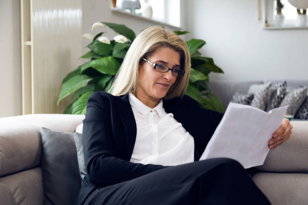 istock Portrait Of Woman Reading A Document 722320785