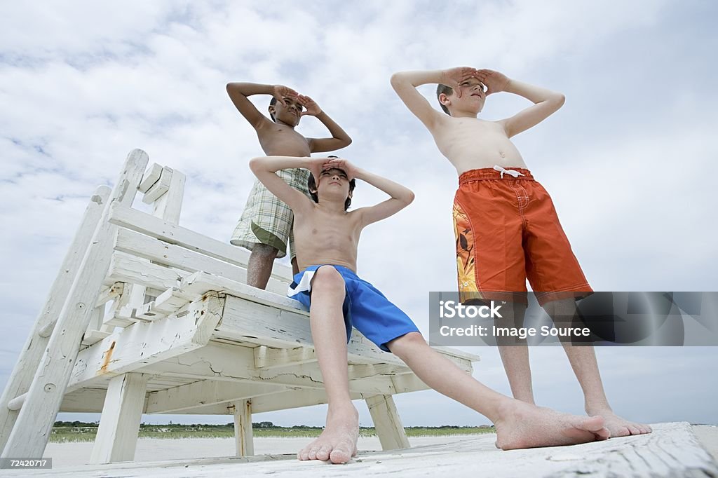 Boys looking  Barefoot Stock Photo