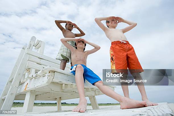 Boys Looking Stock Photo - Download Image Now - Barefoot, Beach, Boys