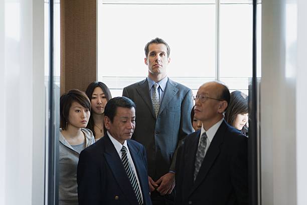 People in an elevator  tall high stock pictures, royalty-free photos & images