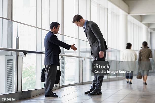Businessmen Greeting Stock Photo - Download Image Now - Cultures, Respect, Social Grace