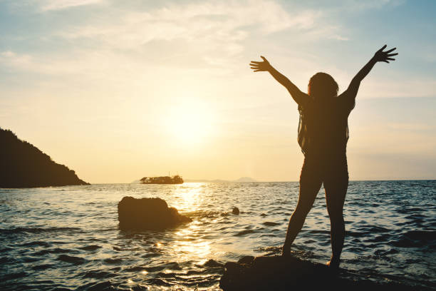 istock Silhouette Of Man On Beach Against Sky During Sunset 724317433