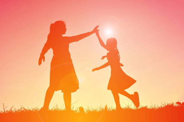 istock Silhouette Mother With Daughter On Field Against Sky 726856603