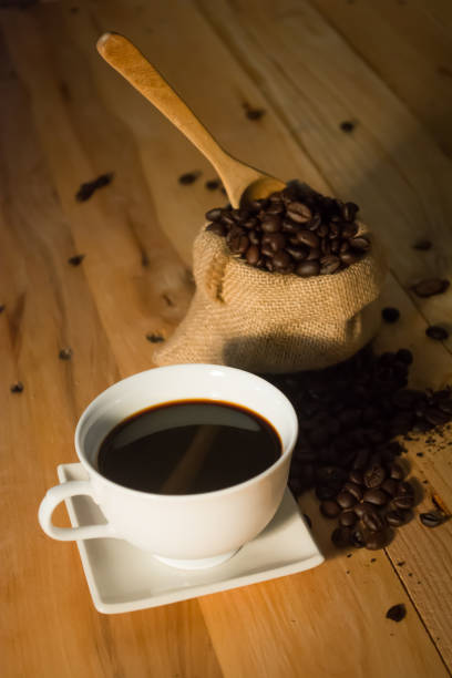 istock Cup By Grinder And Roasted Coffee Beans On Wooden Table 726874257