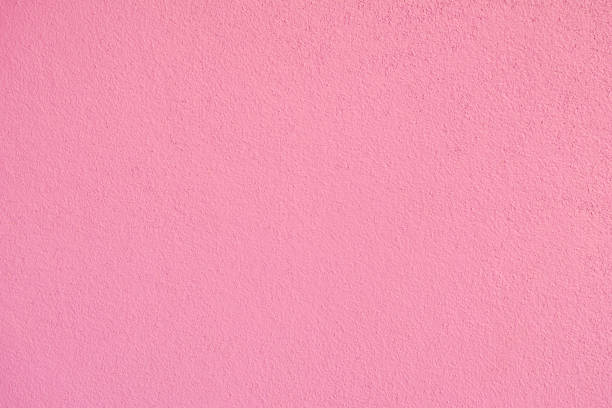 Overhead shot of pink fabric texture background with spot lit.