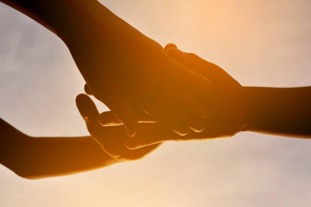 istock Cropped Image Of Friends Stacking Hands During Sunset 726882619