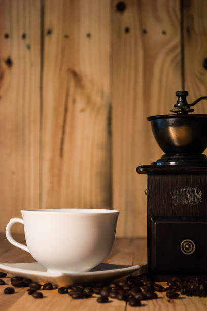 istock Vintage Coffee Grinder By Cup On Wooden Table 726887279