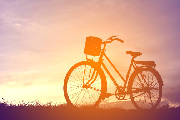istock Silhouette Bicycle Parked On Field Against Sky During Sunset 726893241